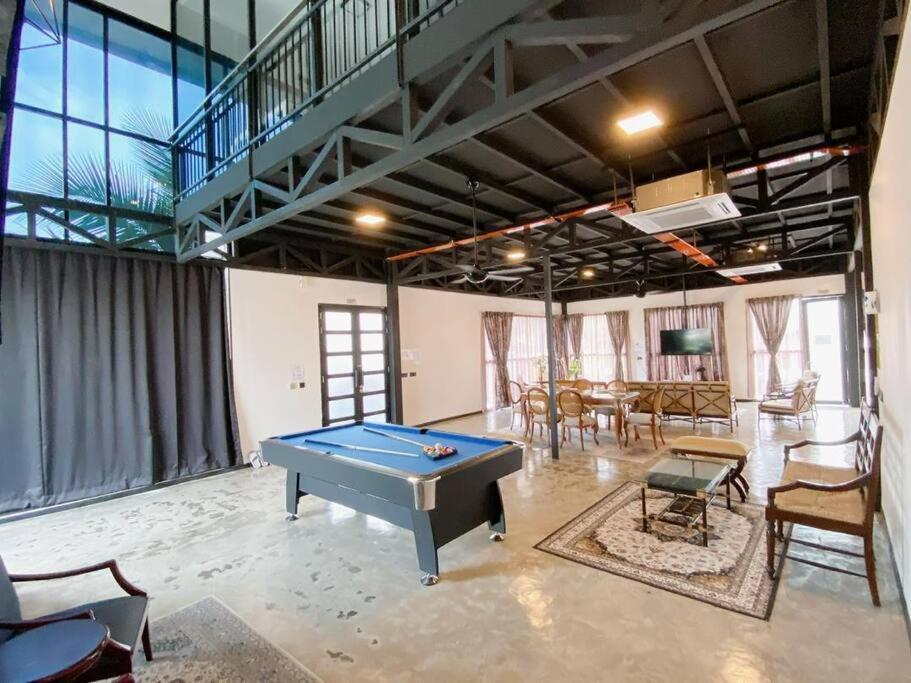 a large room with a pool table in it at B03 Larkin Bungalow Homestay in Johor Bahru