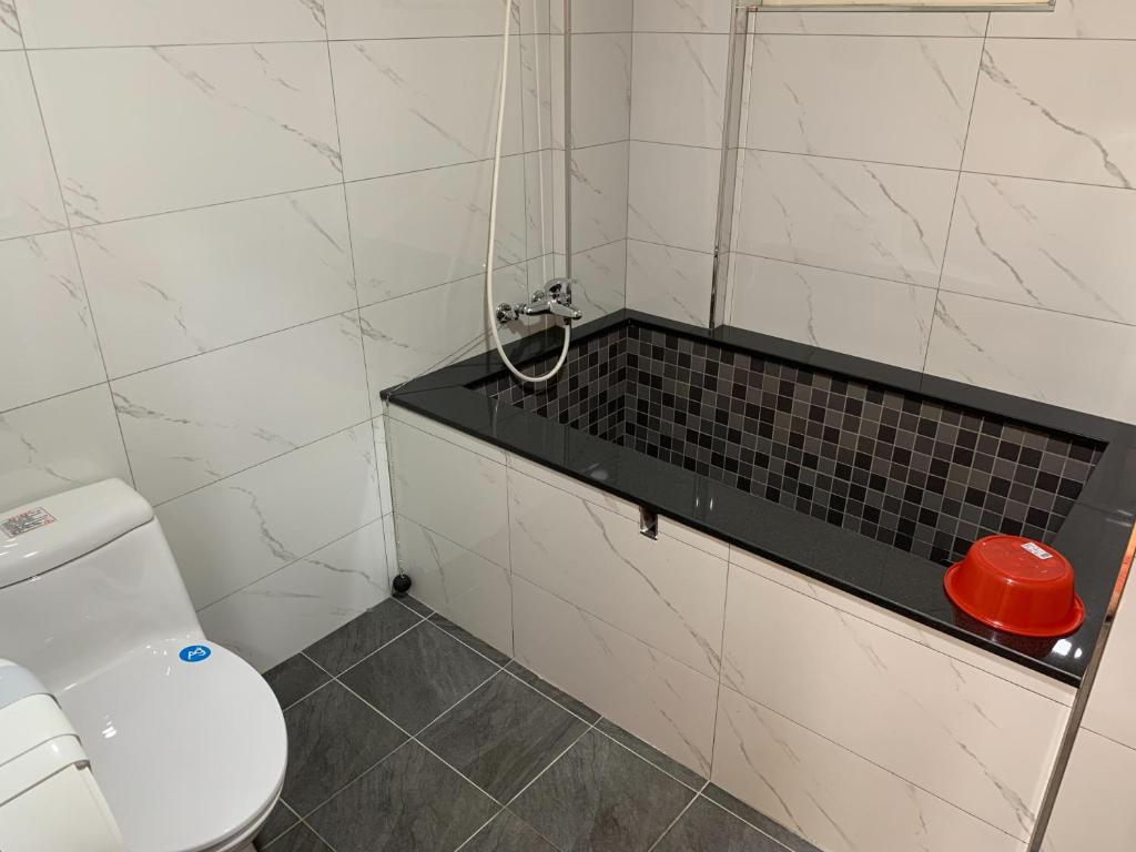 Koupelna v ubytování 溫沙堡汽車旅館 Windsor Castle Garden Motel