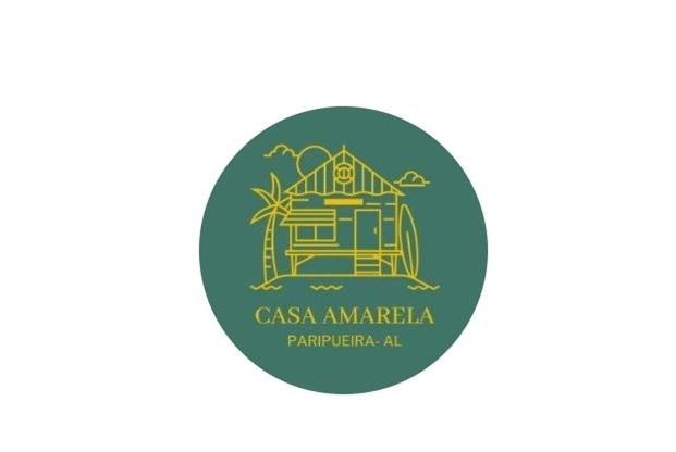 帕里普埃拉的住宿－Casa Amarela Paripueira，绿色圆圈,有casa amarilla标志