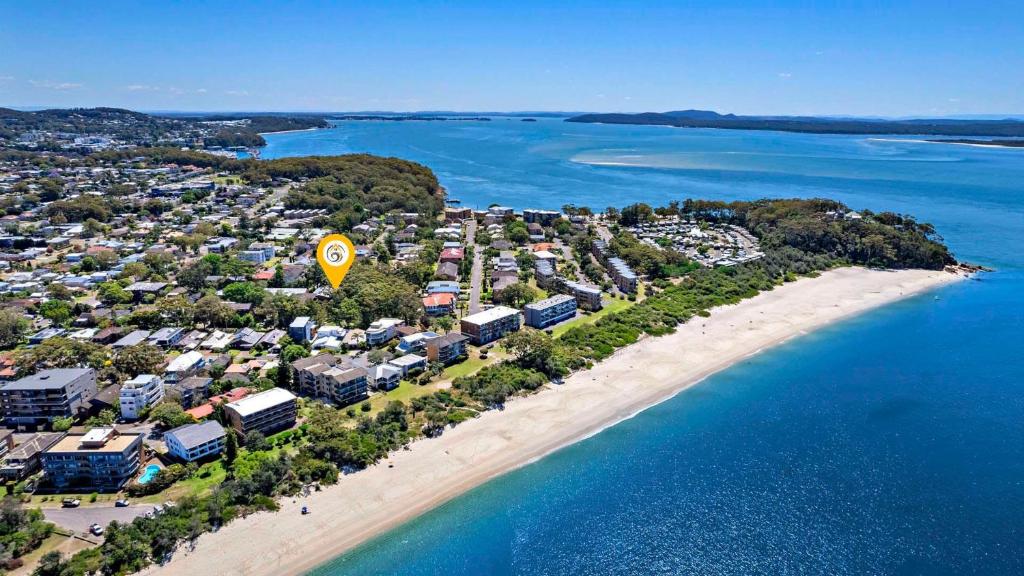 an aerial view of a beach with a resort at Catalina 12 Holiday House Walk to Beaches in Nelson Bay