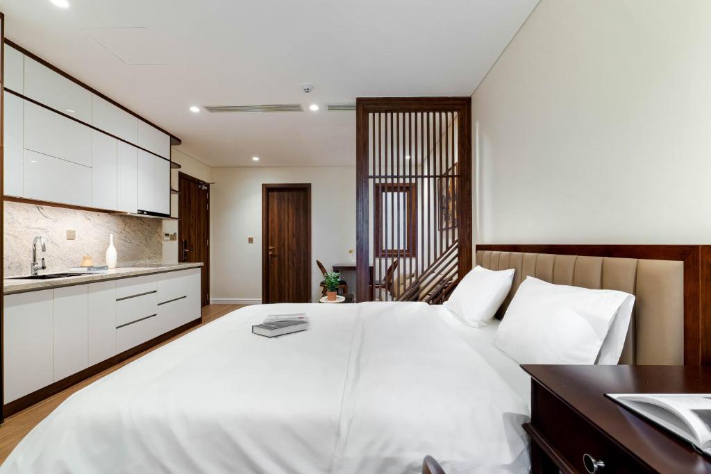 Giường trong phòng chung tại MK Riverside Apartment by Haviland