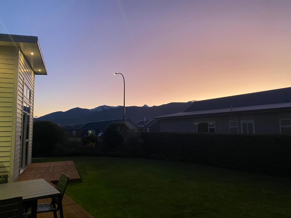 a view of a backyard with a table and a street light at Luxury on Howden in Te Anau