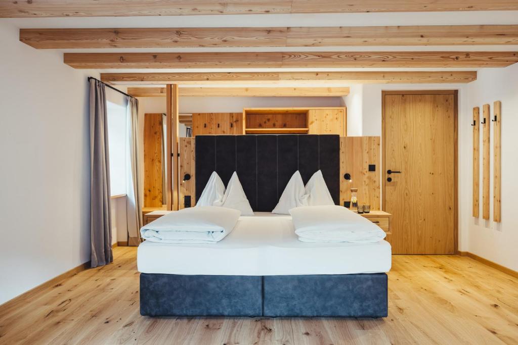 Postel nebo postele na pokoji v ubytování Hotel Schmuckhof
