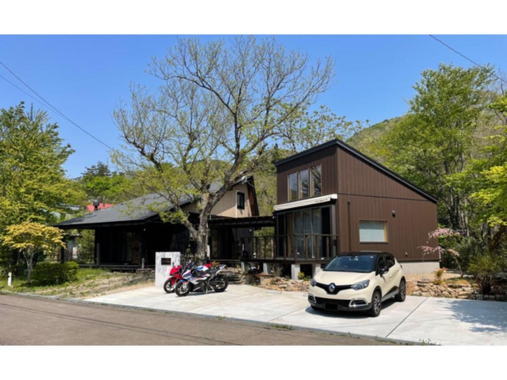 a white car parked in front of a house at Villa Aone - Vacation STAY 82324v in Kawasaki