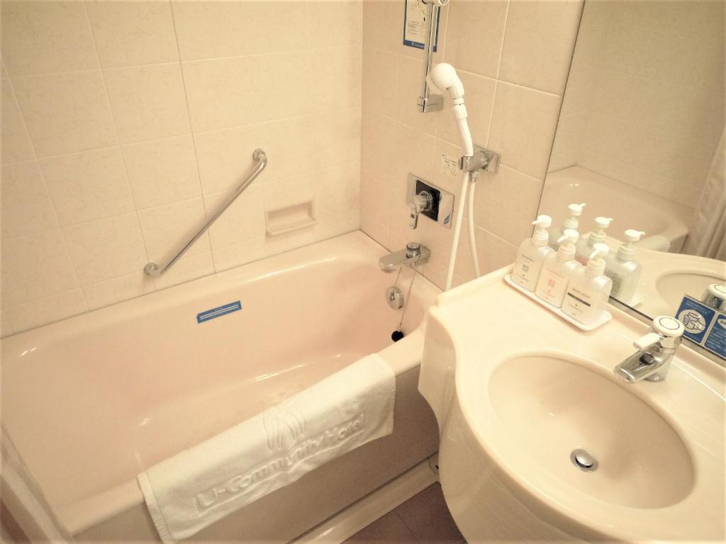 Koupelna v ubytování U-Community Hotel