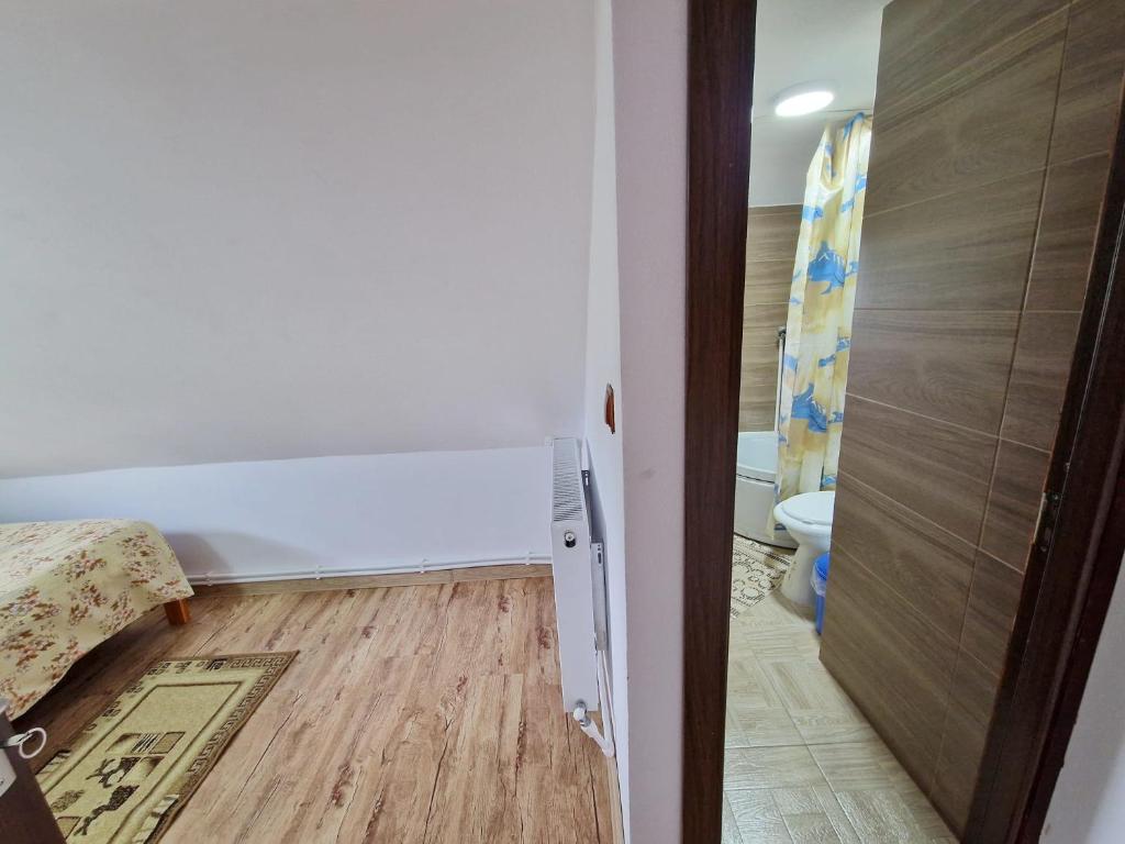 Postel nebo postele na pokoji v ubytování Cabana Poiana Dealul Frumos