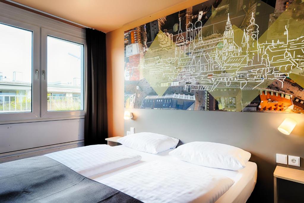 Postel nebo postele na pokoji v ubytování B&B Hotel München-Hbf