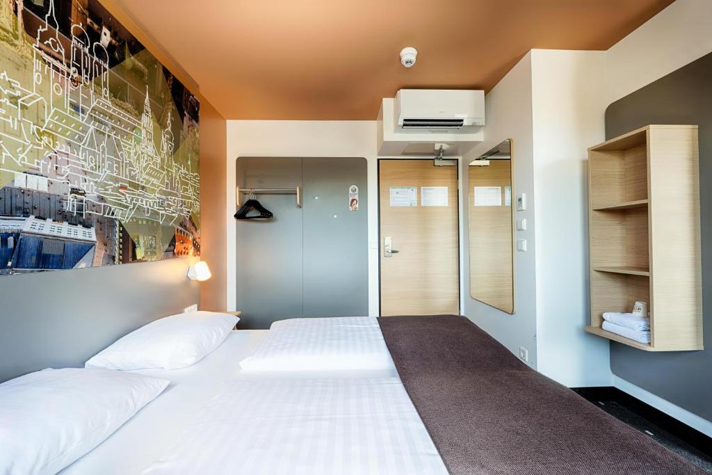 Postel nebo postele na pokoji v ubytování B&B Hotel München-Hbf