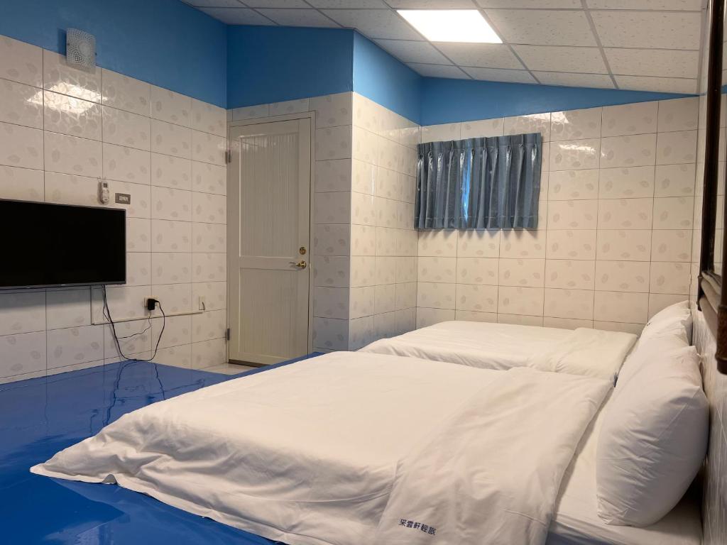 Postel nebo postele na pokoji v ubytování 采雲軒輕旅包棟Villa