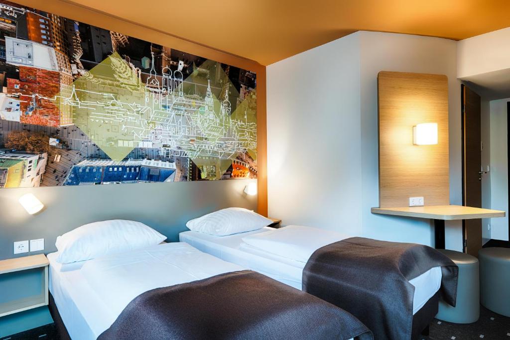 Postel nebo postele na pokoji v ubytování B&B Hotel München-Hbf