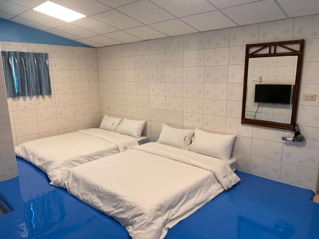 Postel nebo postele na pokoji v ubytování 采雲軒輕旅包棟Villa