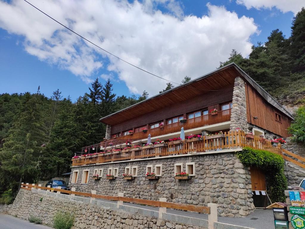 a building on the side of a mountain at Chambres d'hôtes Le Grand Chalet in Valdeblore