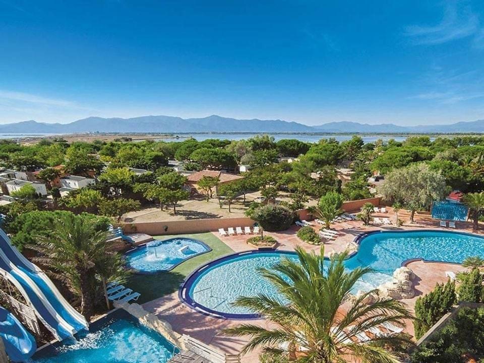 an aerial view of a resort with two pools at Mobil Home Camping Mar Estang 4* in Canet-en-Roussillon