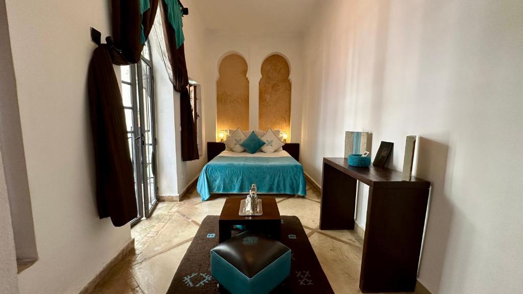 Postel nebo postele na pokoji v ubytování Riad Jardin Des Rêves By La Siredrah