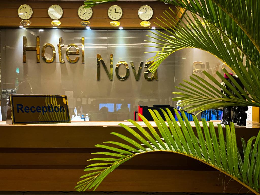 a hotel november sign in the window of a store at The Hotel Nova in Mandalay