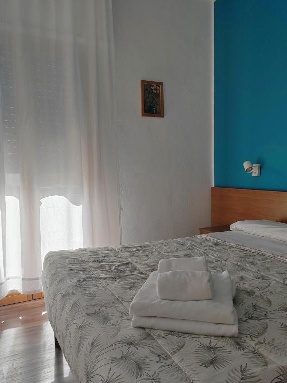 Postel nebo postele na pokoji v ubytování Hotel Luisa