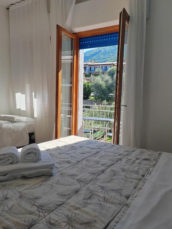 Postel nebo postele na pokoji v ubytování Hotel Luisa