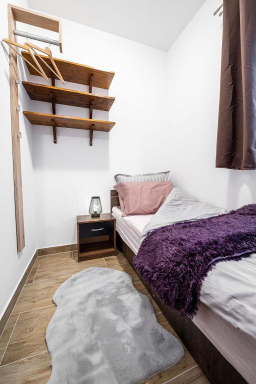 Postel nebo postele na pokoji v ubytování Apartmaji Koza