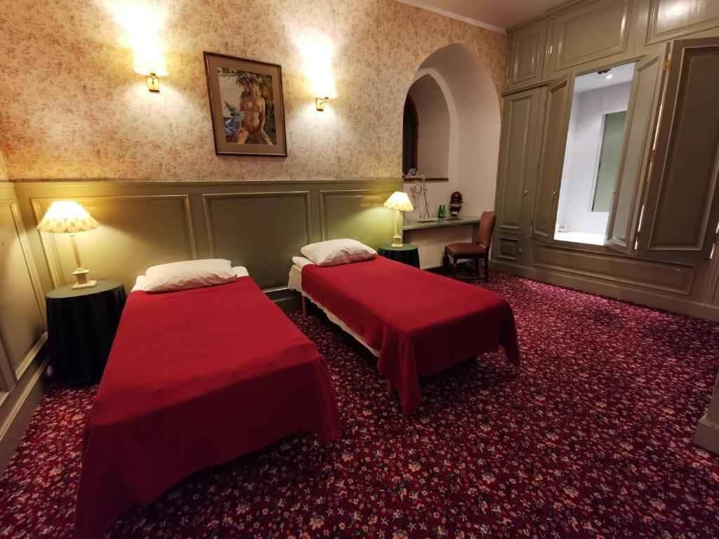 Postel nebo postele na pokoji v ubytování Laitse castle