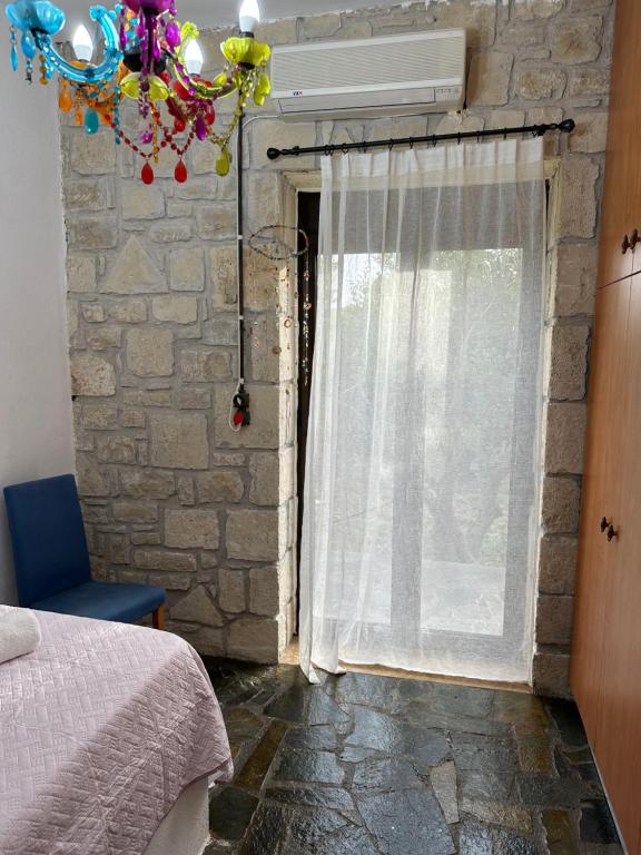 A bed or beds in a room at Elia Home