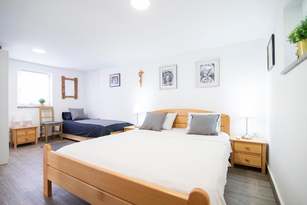 Postel nebo postele na pokoji v ubytování Holiday Home TimeOut Bizovac