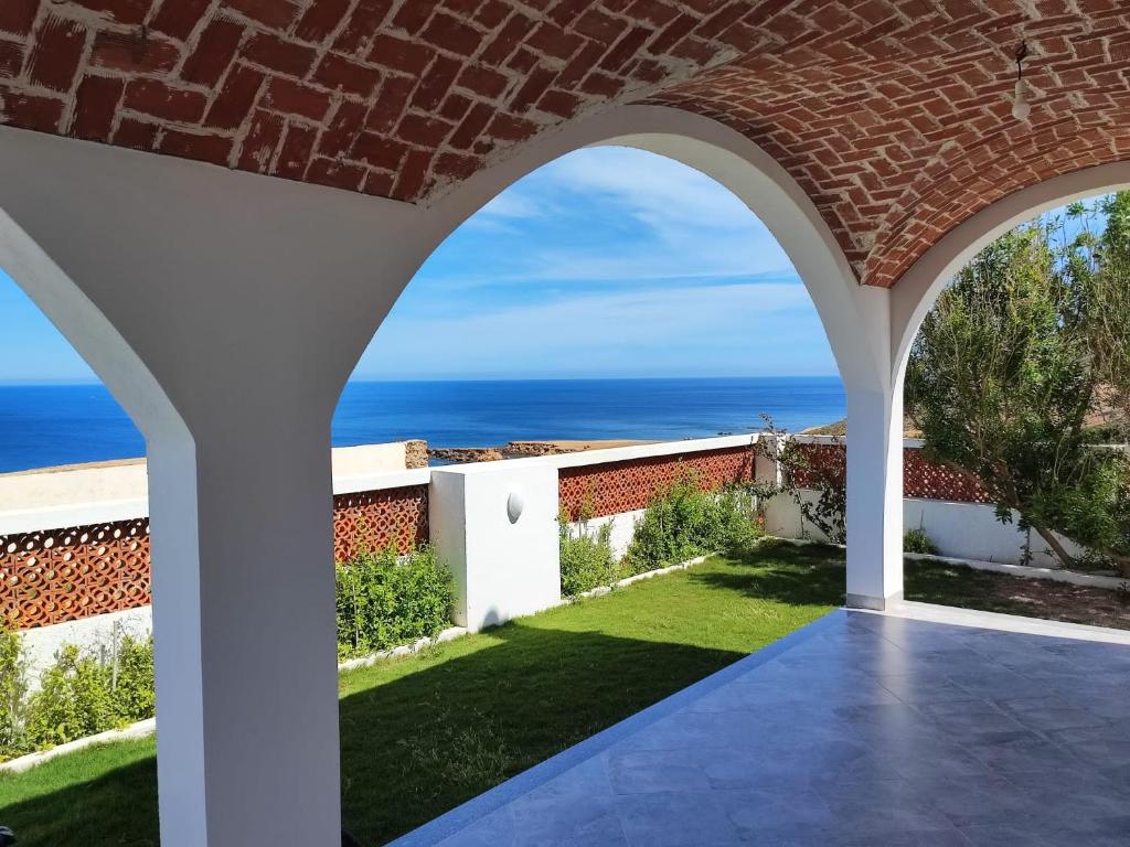 a view of the ocean from the patio of a house at Maison vue mer, île de Zembra et montagne en Tunisie - Elhaouaria in El Haouaria