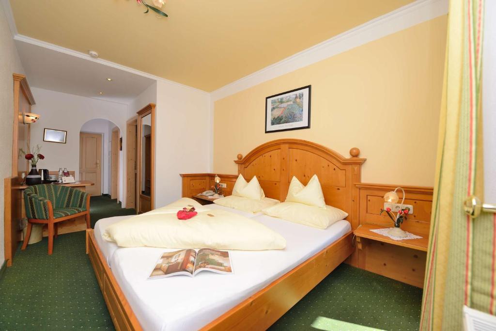Postel nebo postele na pokoji v ubytování Hotel Zimmerbräu