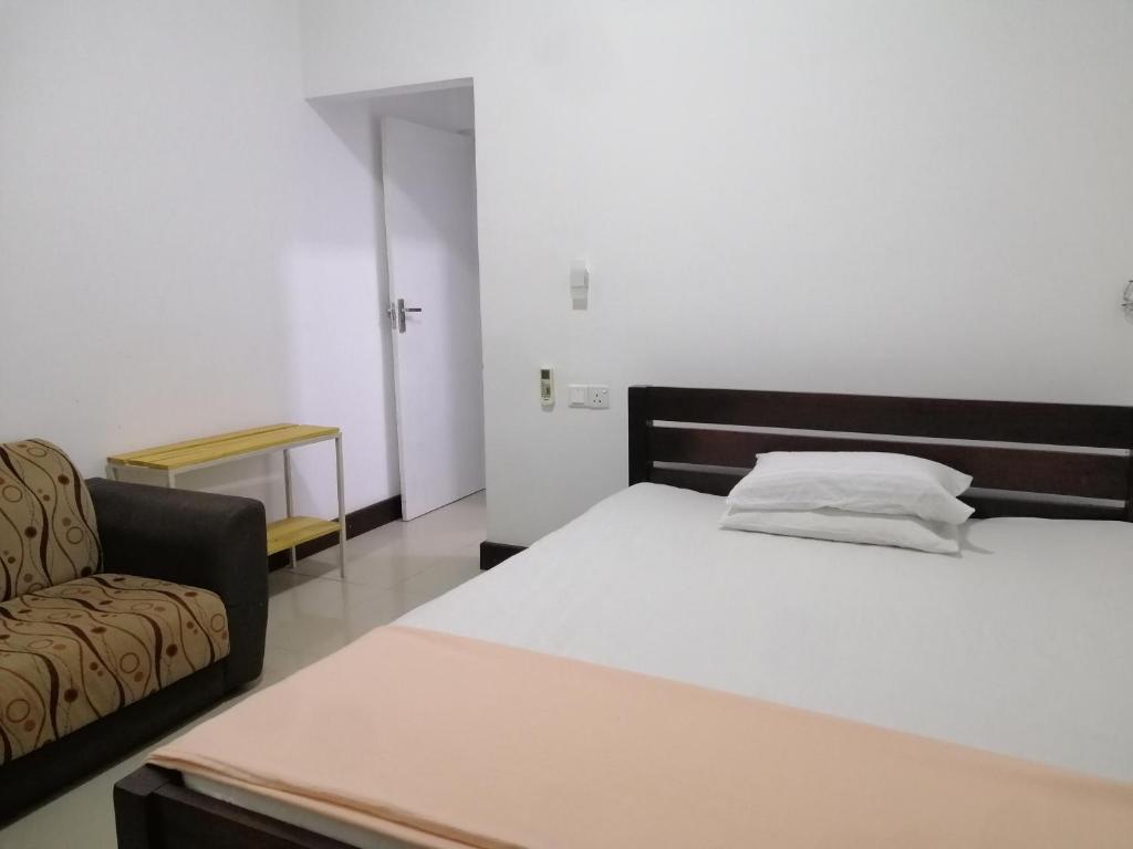 Postel nebo postele na pokoji v ubytování Glenview hotel & homestay