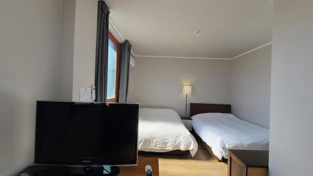 Postel nebo postele na pokoji v ubytování Bella Yuna Inn