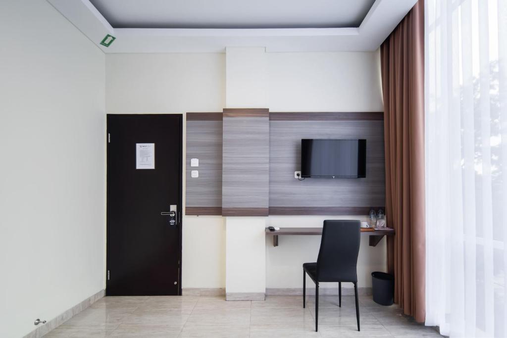 TV a/nebo společenská místnost v ubytování Cove West Inn Cihampelas