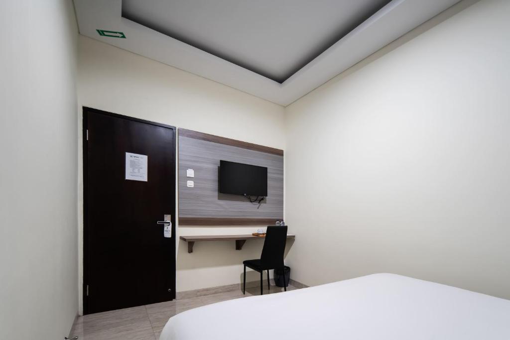 TV a/nebo společenská místnost v ubytování Cove West Inn Cihampelas