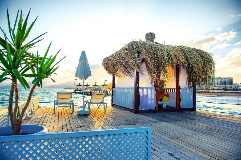 a small hut on the beach near the water at Liberty Hotels Lara in Lara
