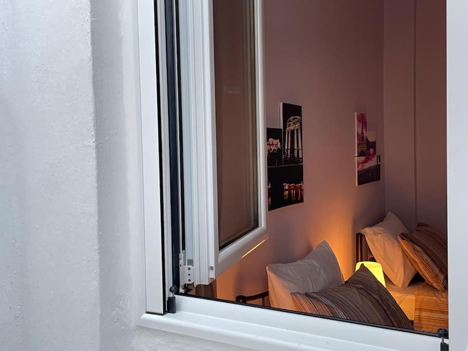 Postel nebo postele na pokoji v ubytování Nafpaktian Port House