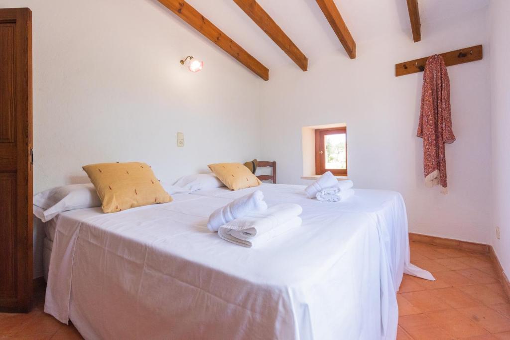 Postel nebo postele na pokoji v ubytování Hortella -Ecofinca-