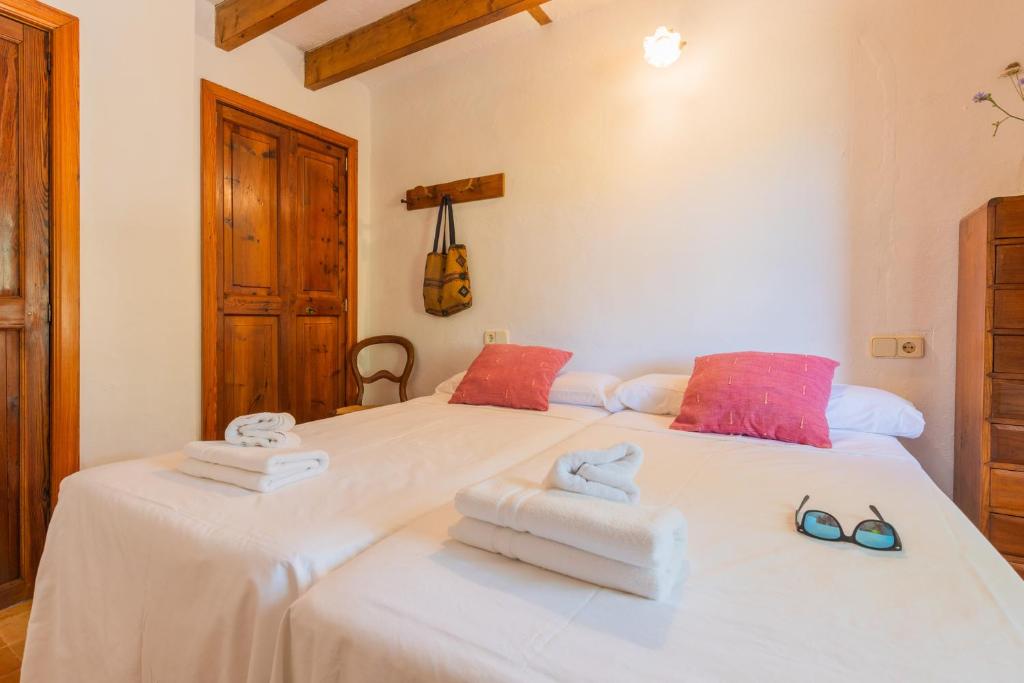 Postel nebo postele na pokoji v ubytování Hortella -Ecofinca-