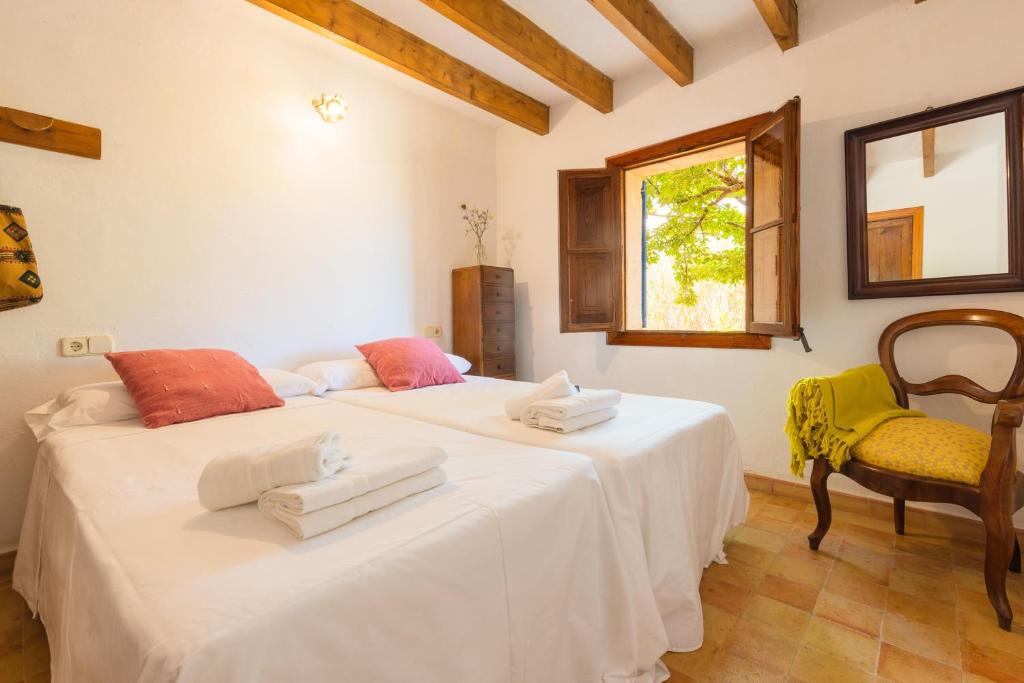 Postel nebo postele na pokoji v ubytování Hortella -Ecofinca-