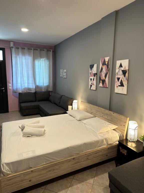 Postel nebo postele na pokoji v ubytování Grey Pearls Apartments