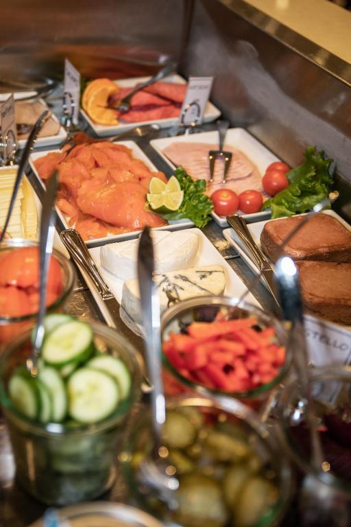a table with many different types of food on it at Tromsø Lodge & Camping in Tromsø