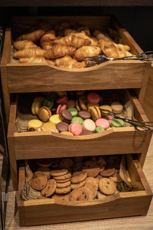 two wooden boxes filled with different types of cookies at Tromsø Lodge & Camping in Tromsø