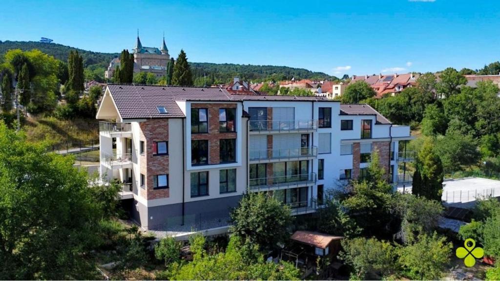 an aerial view of a large house with trees at Comfy Apartment Bojnice in Bojnice