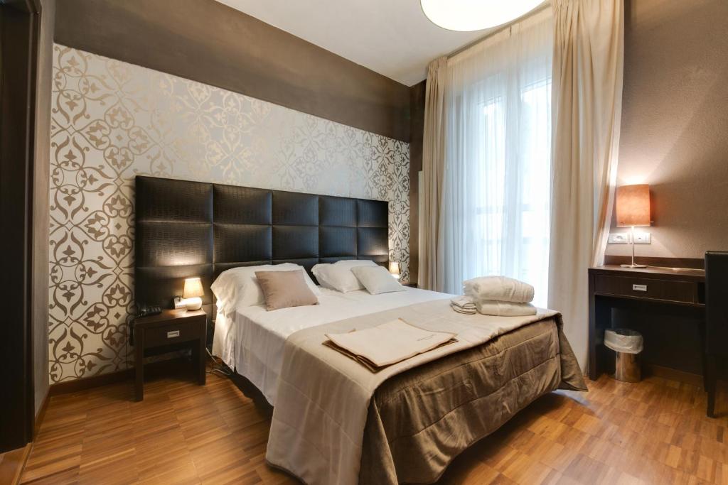 Postel nebo postele na pokoji v ubytování Atmosfere Milano Marittima