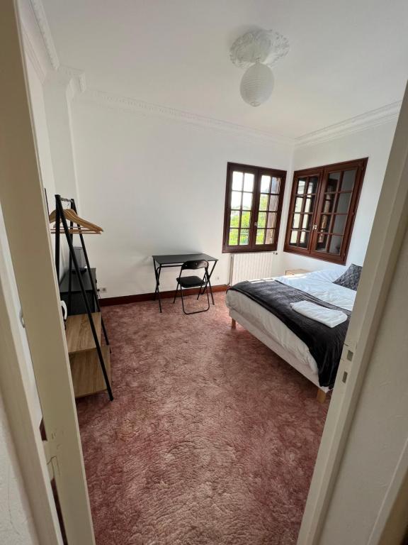 Postel nebo postele na pokoji v ubytování Auberge Mer