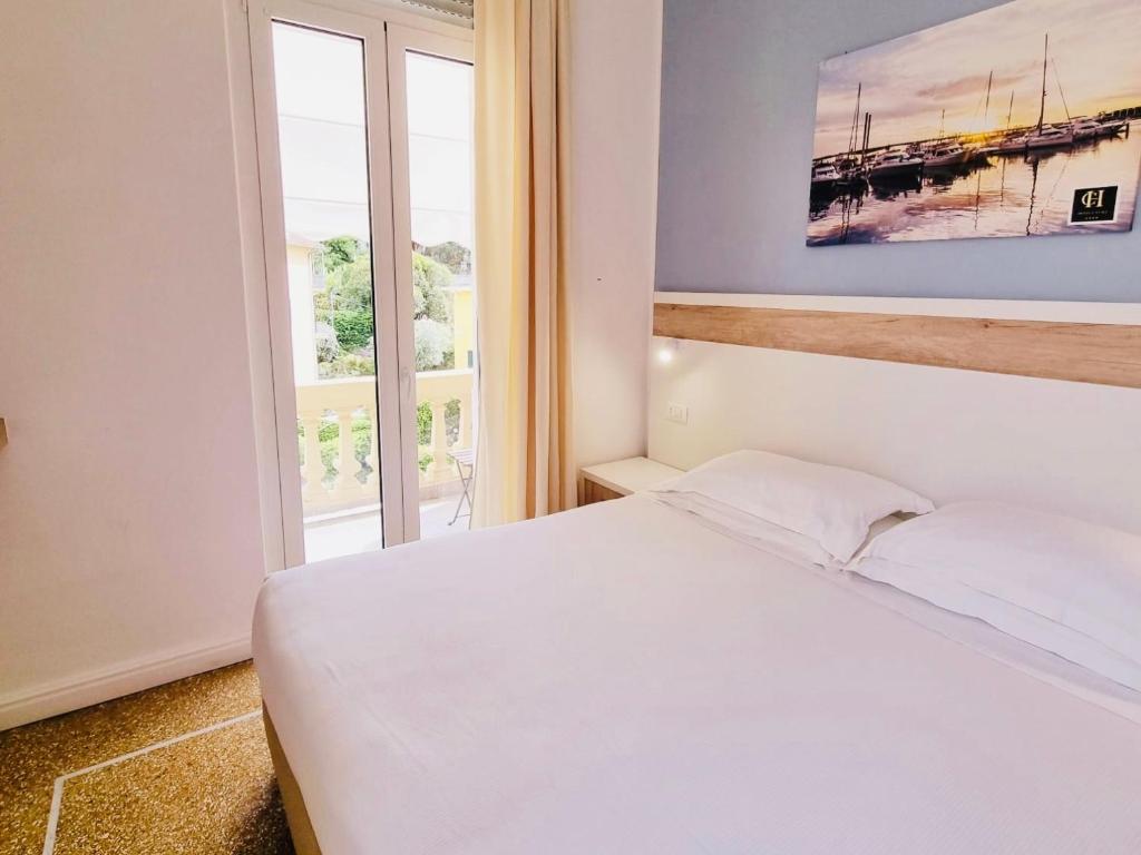 Postel nebo postele na pokoji v ubytování Hotel Canali, Portofino Coast
