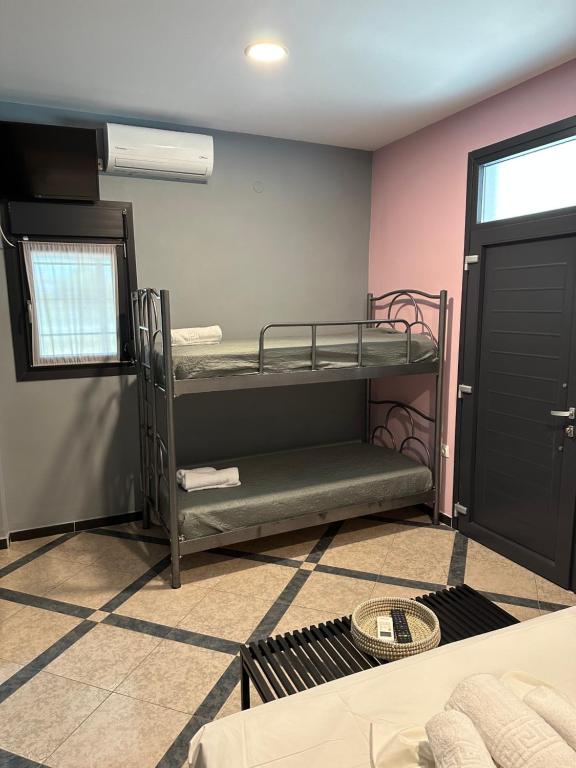 Postel nebo postele na pokoji v ubytování Grey Pearls Apartments