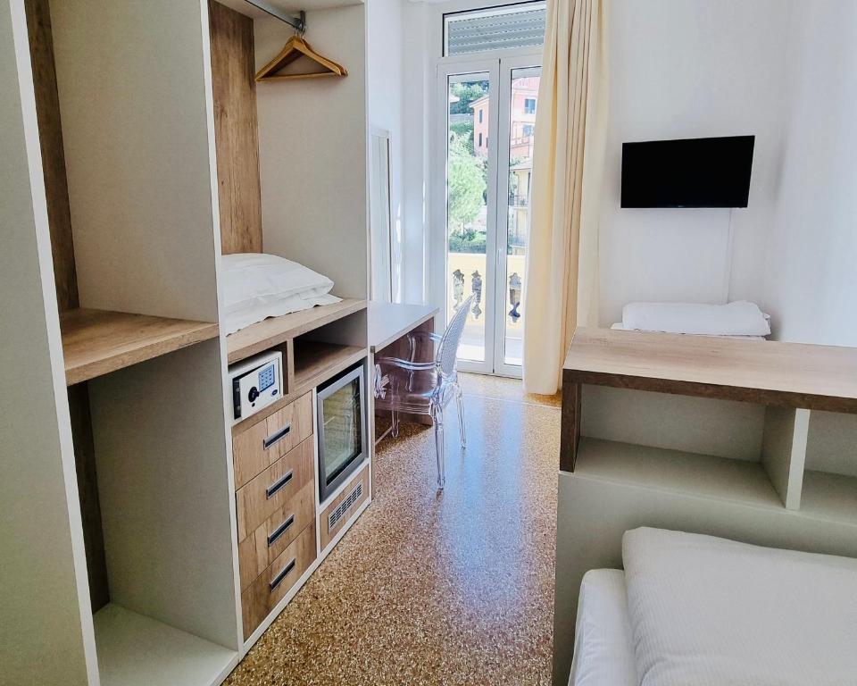 TV a/nebo společenská místnost v ubytování Hotel Canali, Portofino Coast