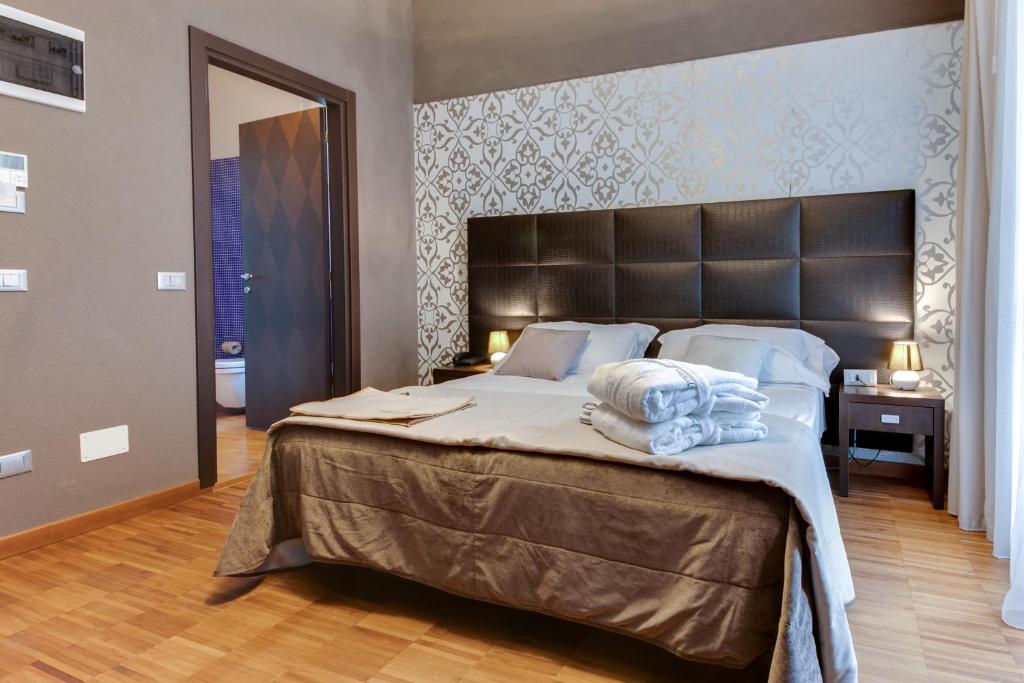 Postel nebo postele na pokoji v ubytování Atmosfere Milano Marittima