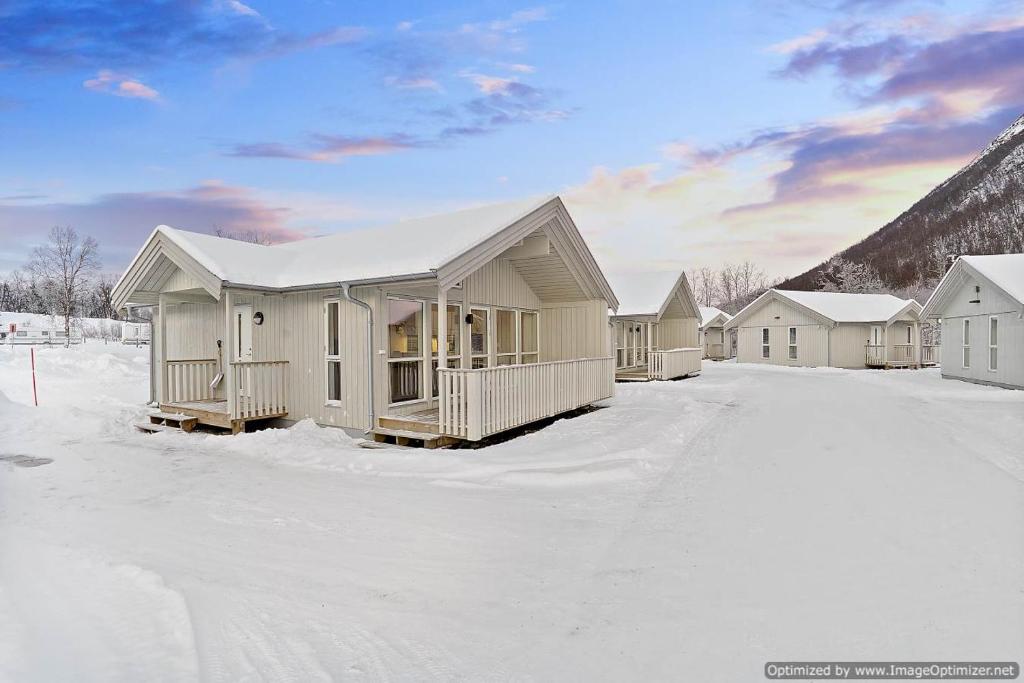 a row of houses in the snow at Tromsø Lodge & Camping in Tromsø