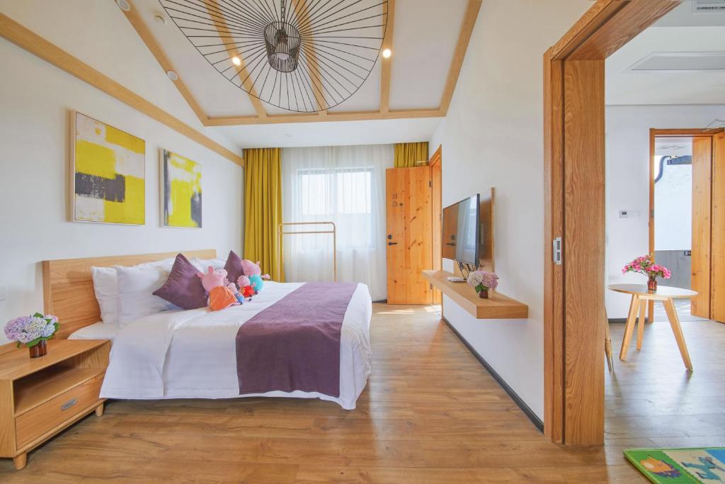 Postel nebo postele na pokoji v ubytování WuZhen Dream Hotel