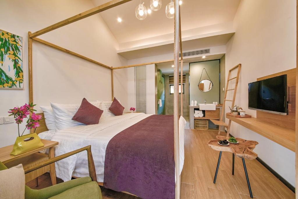 Postel nebo postele na pokoji v ubytování WuZhen Dream Hotel