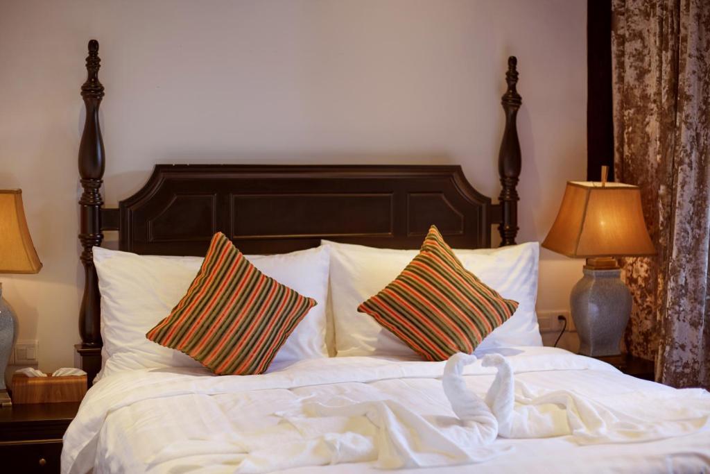 Postel nebo postele na pokoji v ubytování WuZhen Dream Hotel